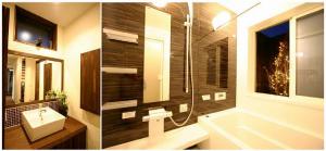 大きな鏡とタイルがアクセントの造作洗面台。お風呂から眺める坪庭。季節の演出で至福のバスタイムが味わえます。